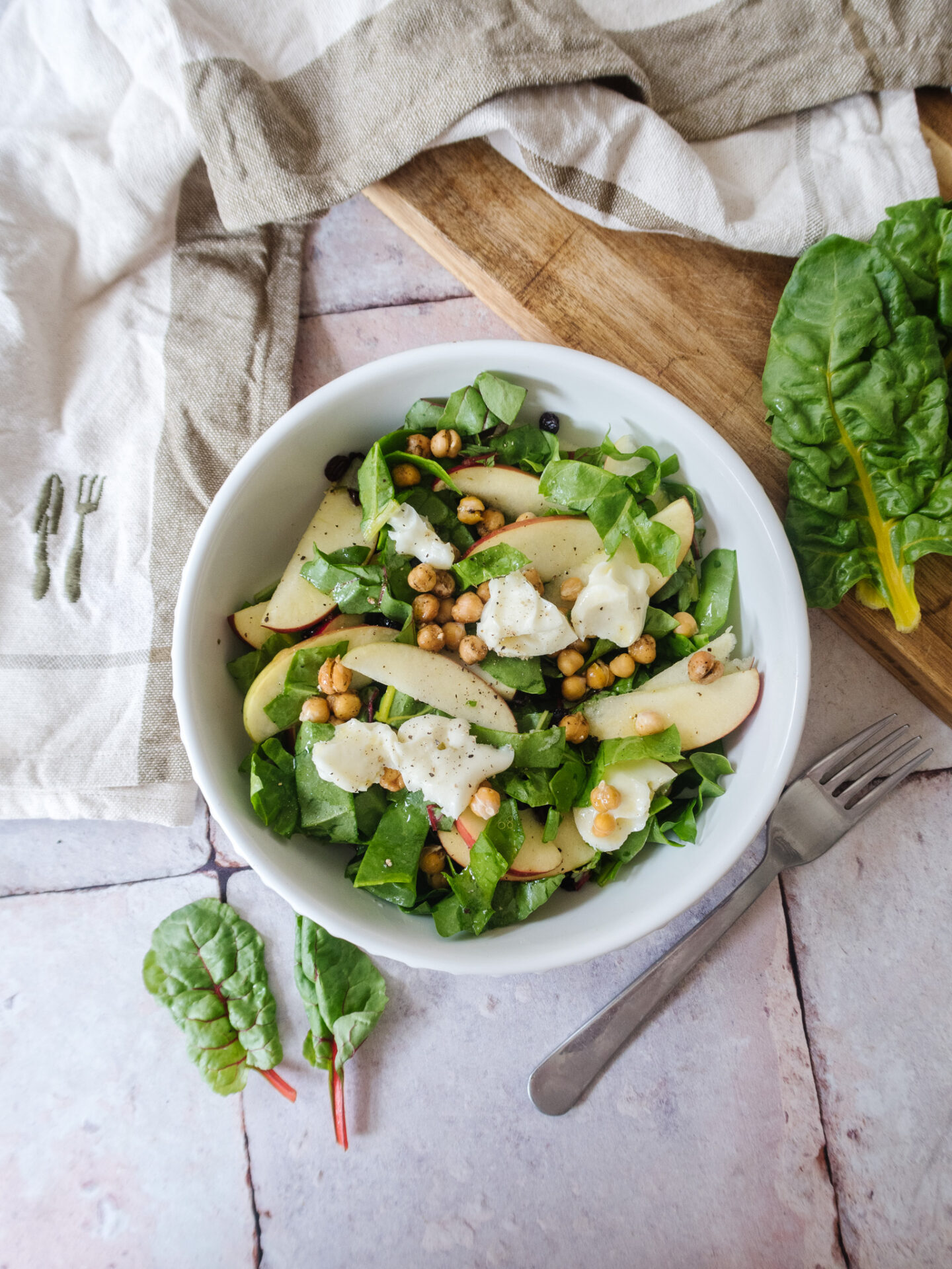 an edited lifestyle recipe rainbow chard and apple goats cheese salad