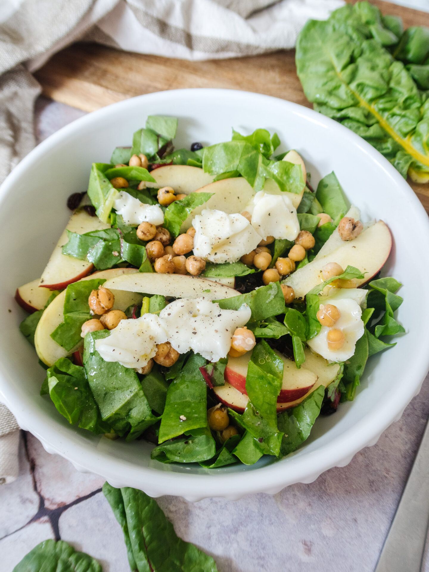 an edited lifestyle recipe rainbow chard and apple goats cheese salad