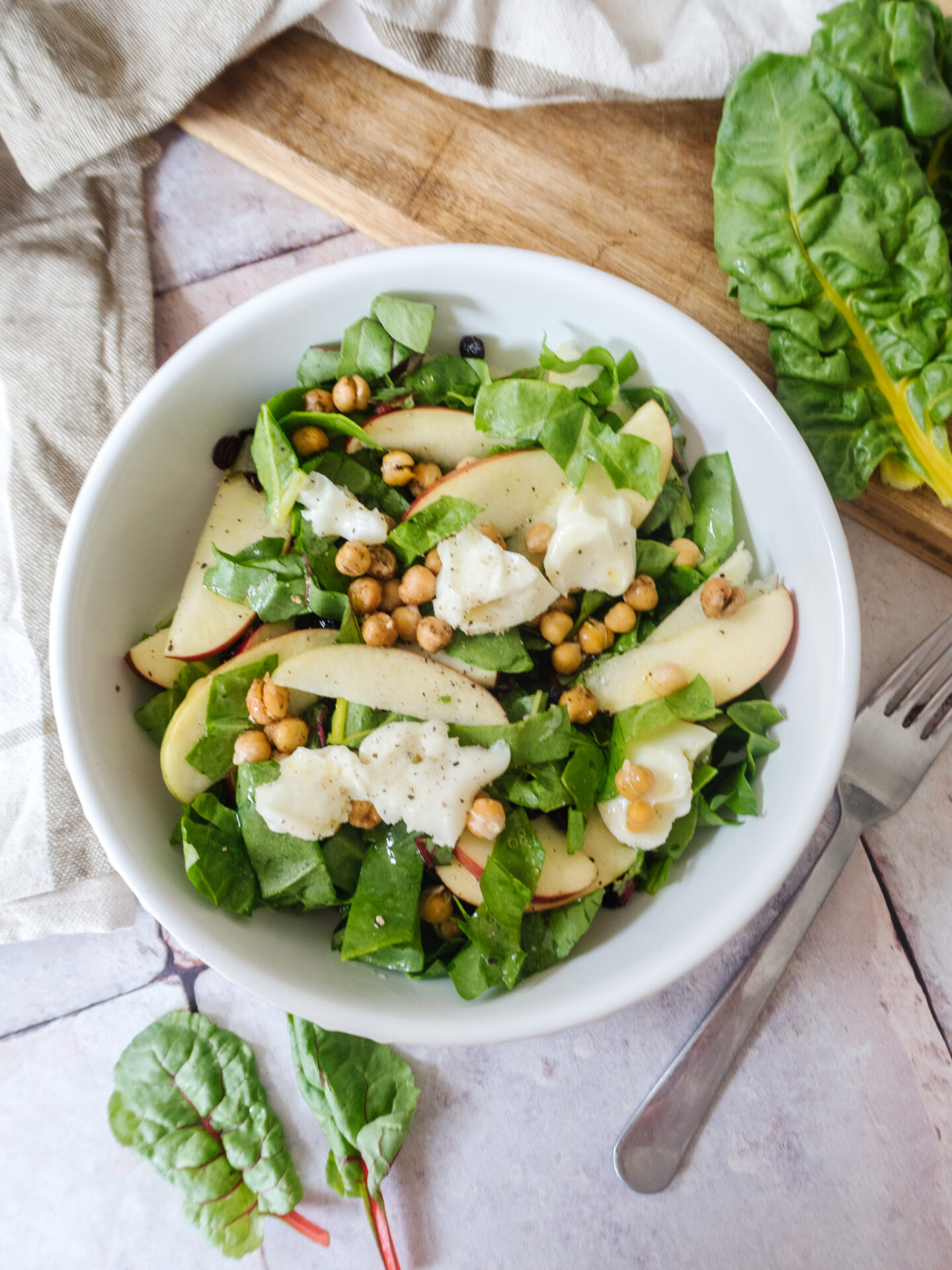 an edited lifestyle recipe rainbow chard and apple goats cheese salad
